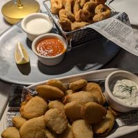 Fried pickle and fried calamari appetizers. Both excellent! at Willow Vegan Bistro in New York City
