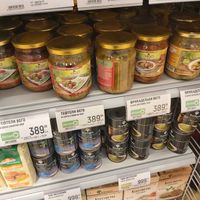 Shelf with canned vegan food nearby vegan corner at Globus in Pushkino