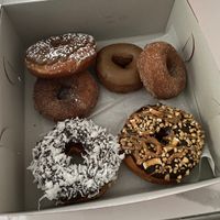 French toast, maple pancake, apple cider, chocolate coconut, and snickers  at Donut Run in Washington