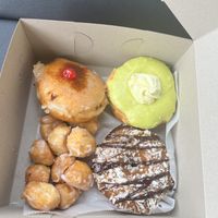 (From top left clockwise): Pineapple upside down, pistachio lemon, Samoa, and donut holes  at Donut Run in Washington