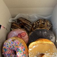 the homer, french toast, strawberry, cookies and cream, samoa, snickers  at Donut Run in Washington