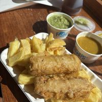 Battered Vegan Sauce and chips with mushy peas and curry saucee  at Mr Chippy in York