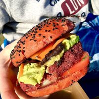 Quinoa and beetroot burger: red quinoa, beetroot and veggie burger, avocado-tahini sauce, parsley and raw sweet potato, quason mushrooms, tomato, lettuce leaves, beetroot bun. at The Brewery in Larnaca
