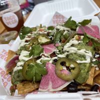 Amazing nachos with watermelon radish and jalapeños! at Taco Vega in Los Angeles