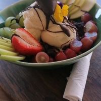 Blueberry oats with vanilla ice cream and fresh fruit salad at The Conscious Kitchen - Kloof St in Cape Town