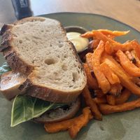 Vegan club sandwich with coconut bacon and marinated tofu with side of sweet potato fries  at The Conscious Kitchen - Kloof St in Cape Town