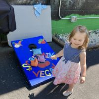Bean bag toss game out back while waiting a short time for our food   at Screaming Vegan in Roanoke