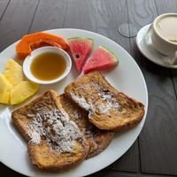 Vegan french toast with maple syrup and tea with oat milk at Thirema Coffee Shop and Restaurant in Tortuguero