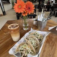 Vegan pulled pork tacos and iced vanilla oat milk latte   at Eat Street in Santa Teresa