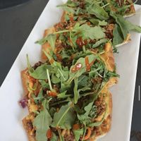 vegan roasted red pepper hummus flat bread  at Shot & Bottle in Lancaster