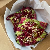 Beetroot hummus & avocado toast at Pink Neon Sign in Auckland