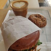 Crispy leek sandwich, chocolate chip and olive oil cookie, and almond milk cappuccino :) at Mela - Old North in Tel Aviv
