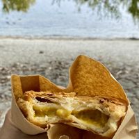 Enjoying the vegan curry pie at the lakefront   at The Doughbin Bakery in Wanaka