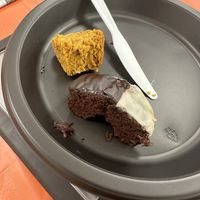 Piece of a pumpkin muffin and a black and white chocolate donut. Donut was insanely delicious.  at No Gluten Kneaded in Bohemia