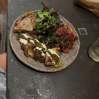 Chose the veggie plate.  Comes with two sides. Smashed potatoes with chimichurri. And tomato/peach salad.  Out of tofu or I would have added that.  at Honest Greens - Born in Barcelona