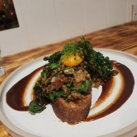 Highlander toast with runny "egg" yolk.  at Green Routes Cafe in Oxford