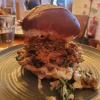 Photo of the Big Festdev - "roast pork" with slaw, apple sauce, mayo, sage&onion stuffing in a pretzel bun. at Green Routes Cafe in Oxford