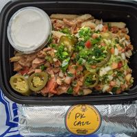 Sisig fries and Cali burrito. at Senor Sisig in Oakland