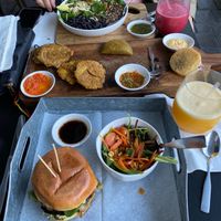 Pesto marinated Portobella burger, avocado, pepperjack , organic spinach, cilantro aioli, sweet plantains, empanadas, tostónes (green plantains) #vegetarian #veggielove at De Leon Latin Cocina in St Augustine