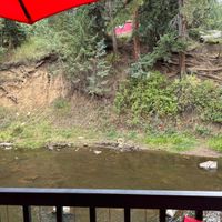 View of the creek from the outdoor dining areaa  at Beau Jo's in Evergreen