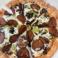 Vegan - crust, cheese, pepperoni, sausage,  olives and green chilis.   at Beau Jo's in Arvada