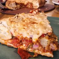 Vegan Vegan sausage and Vegan pepperoni "Mountain Pie" pizza with added calabrian chili peppers and pineapple. at Beau Jo's in Arvada