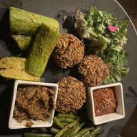 Mixed vegetables plate with falafel, tomato sauce, baba ganoush, zucchini, parsley and green beans.   at La Triskalla in Essaouira