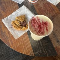Choc chip cookie and oat milk lattee  at Coat Check Coffee in Indianapolis