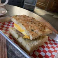 Veg breakfast sandwich can be made vegan, as shown here. Have oat milk for .75 up charge. Several baked goods all made in house.   at Coat Check Coffee in Indianapolis