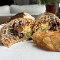  Breakfast burrito w/JUST Egg and yucca fries 😋   at Roasted and Raw in Oakland