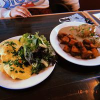 Carrot and lox Benedict and biscuits and gravy  at Allyum in Seattle