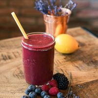 Chillout Smoothie made from apple, lemon, berries and lavander, with a choice of either milk, apple juice or coconut water.  at Fjaka in Amsterdam