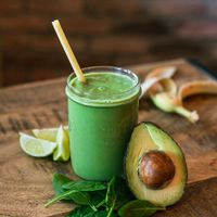 Moringa Smoothie made with fresh avocado, spinage, lime, banana. Comes with a choice of either milk, apple juice or coconut water.  at Fjaka in Amsterdam