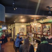 Cozy restaurant with bar and table seating at Farmacy+Fermentary in Charlottetown