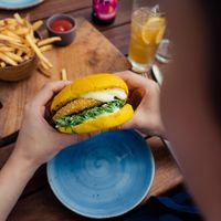 The chick-un burger in turmeric bun with vegan mayo  at The Stables Whitford in Auckland