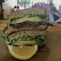 Vegan forest mushroom sandwich with avocado, rocket, hummus, caramelized onions, and sautéed mushrooms on sourdough  at Little Aus - 리틀오스 in Busan
