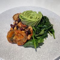 Picnic Cafe’s House Baked Beans, with roasted tomato instead of mushrooms. The baked beans mix has onion  in it. at Picnic Cafe in Hobart