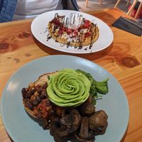 Belgium waffle in the background, main focus is beans on sourdough. at Picnic Cafe in Hobart