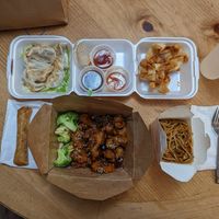 Sesame chicken with fried noodles, Spring rolls, pot stickers and cream cheese wontons. Edit: cream cheese wontons are not vegan* at Veggie Village in Scottsdale
