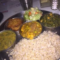 Entrees of lentils, curried tofu and veggies, and spinach with chickpeas  at Ayurveda Cafe in New York City