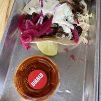 Taco and hot sauce   at Más Veggies Taqueria in Cambridge