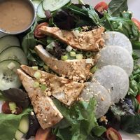 Thai chili peanut salad veganized with a marinated and seared tofu. Housemade peanut dressing. Daikon radishes. This was so good. I could eat it daily   at Eatcetera in Galveston