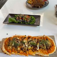 Fennel flatbread, ahi stack, patty melt  at Belse in Dallas