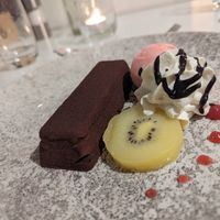 Hazelnut and kiwifruit dessert at Tītī Restaurant in Dunedin