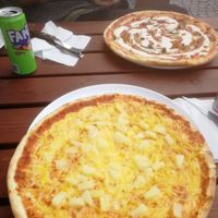 A vegan pineapple pizza and vegetarian kebab pizza with ajvar sauce.  at Tre Vänner Pizzeria in Oskarshamn