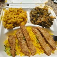 Chicken platter with rice, collards, and mac + cheese at Pure Soul in Durham