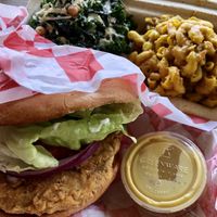 The chicken sandwich platter with kale salad and mac at Pure Soul in Durham