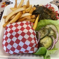 Chicken sandwich plate w/collards, fries and goodness 😋  at Pure Soul in Durham