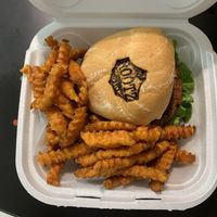 Green burger (vegan) with sweet potato fries  at Rootz Soul Cafe in North Lauderdale