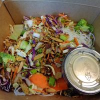 Sesame Salad. Romaine, broccoli slaw, rice noodles, almond + sesame chili crunch, creamy sesame vinaigrette  at Chardon Buckeye Chocolate Café in Chardon